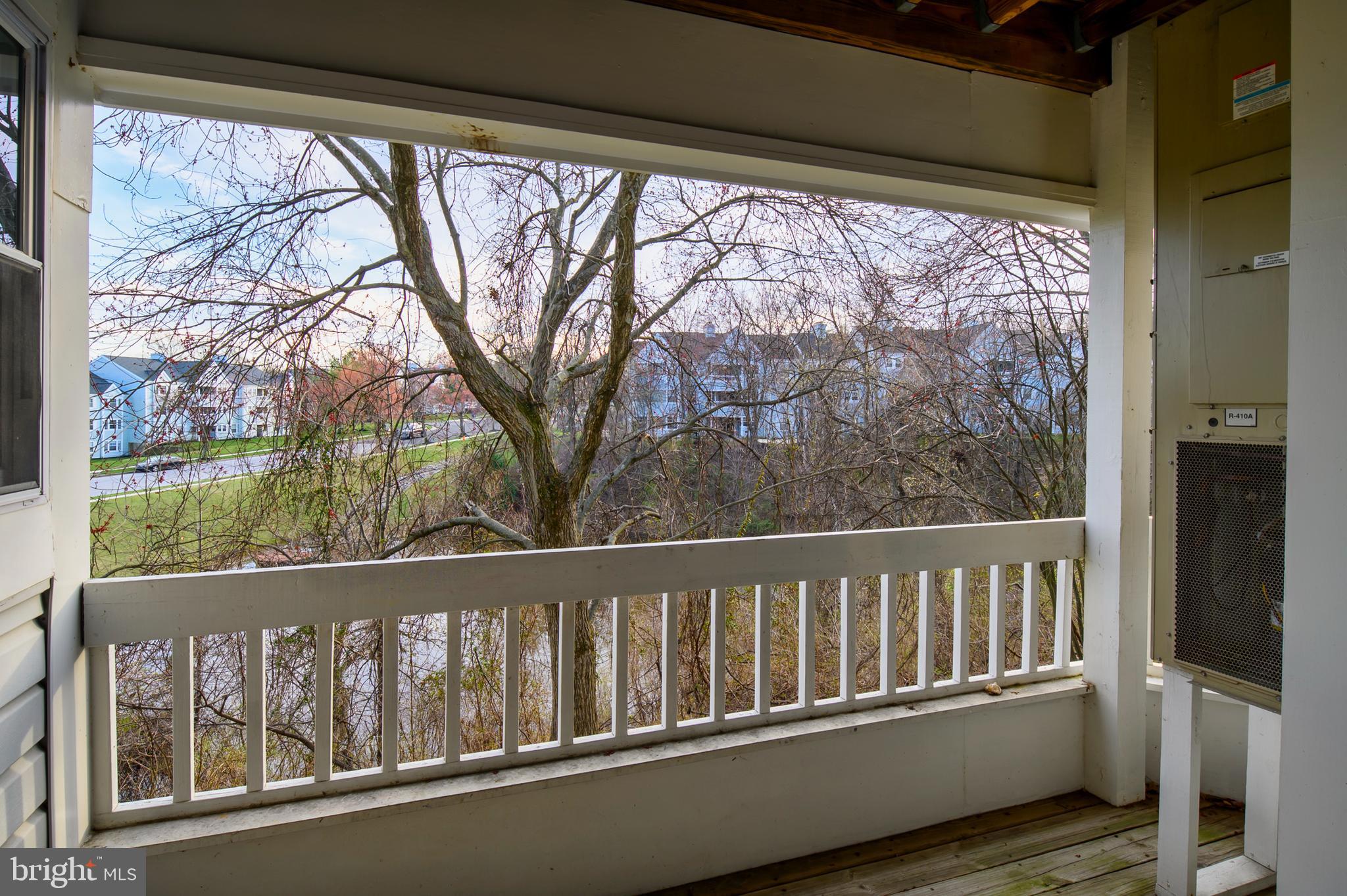8360 Montgomery Run Road, Unit G Ellicott City, MD 21043 - Photo 4 of 20 a view of a wooden balcony