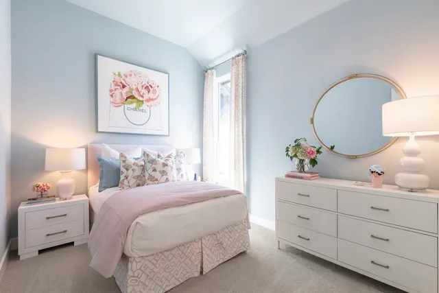 a bedroom with a bed and a dresser