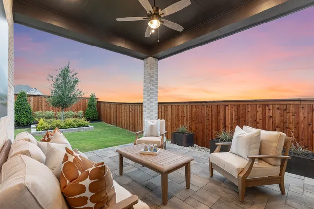 a balcony with furniture and a garden