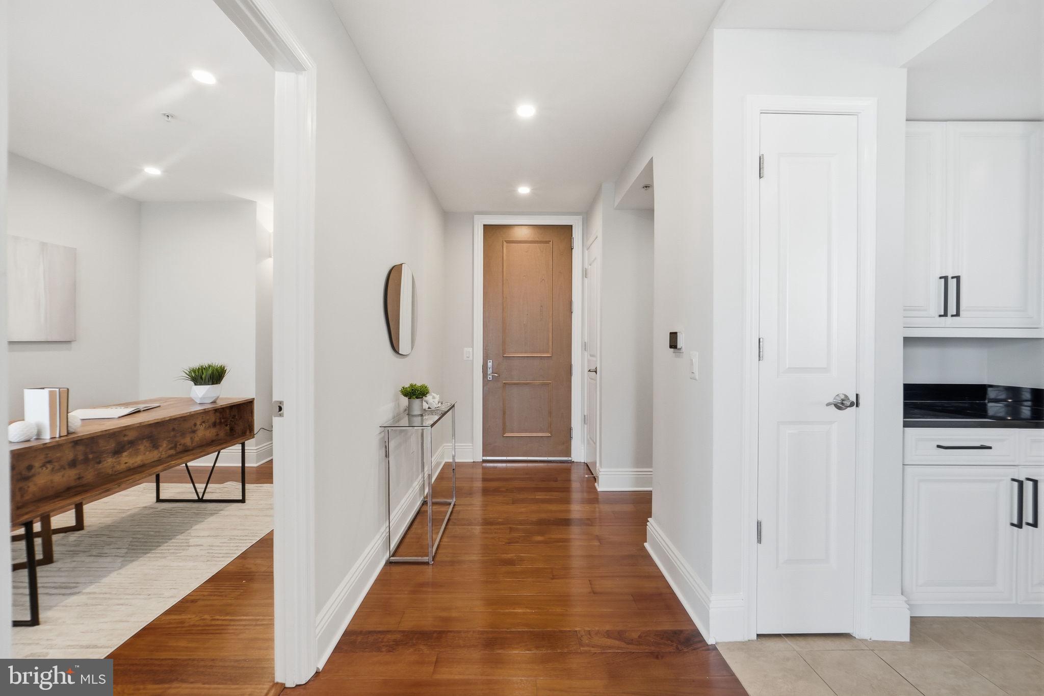 11990 Market Street, Unit 2103 Reston, VA 20190 - Photo 3 of 78 Inviting entryway with modern elegance.