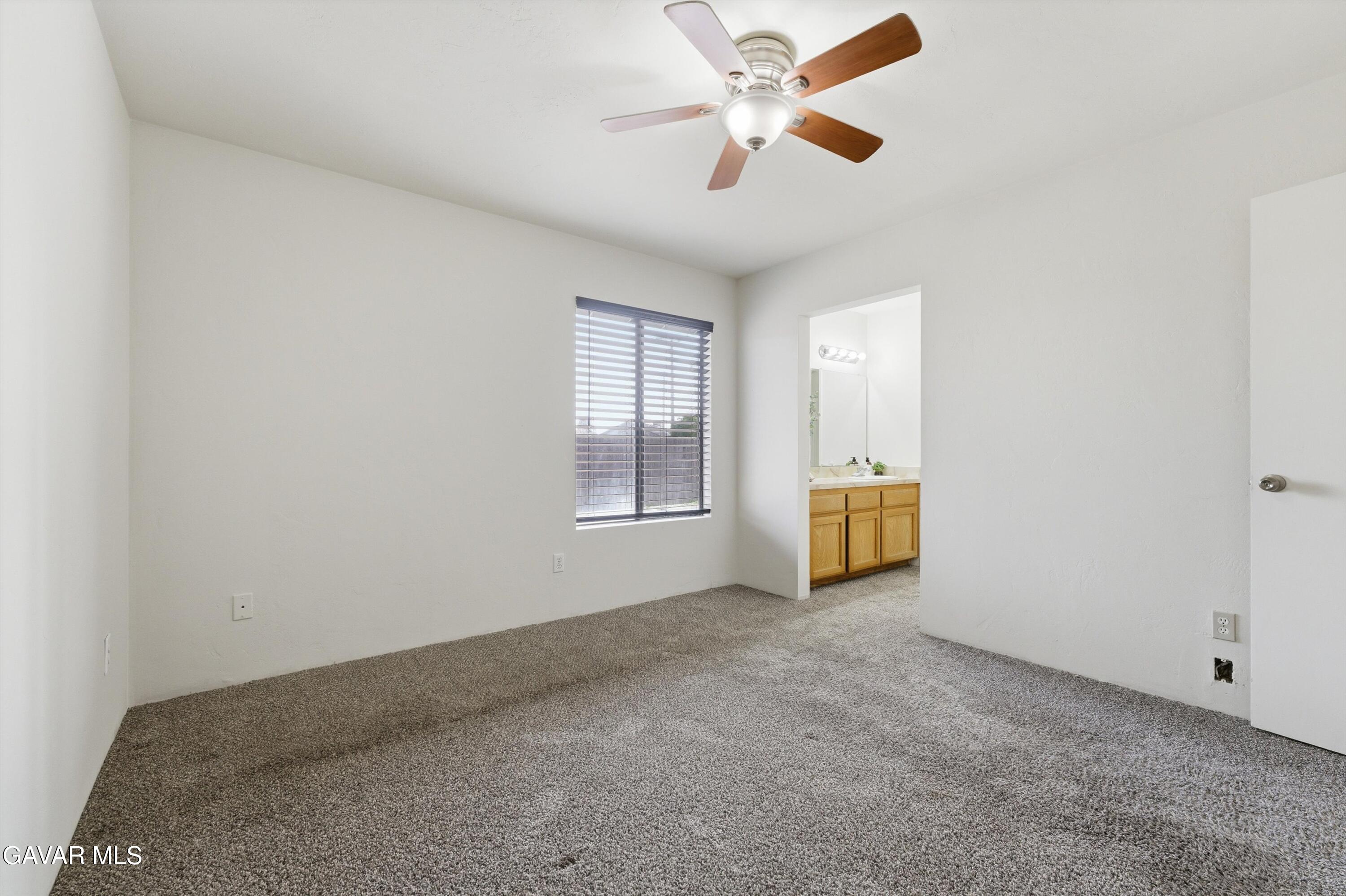 21410 Mission Street Tehachapi, CA 93561 - Photo 13 of 19 an empty room with windows and fan