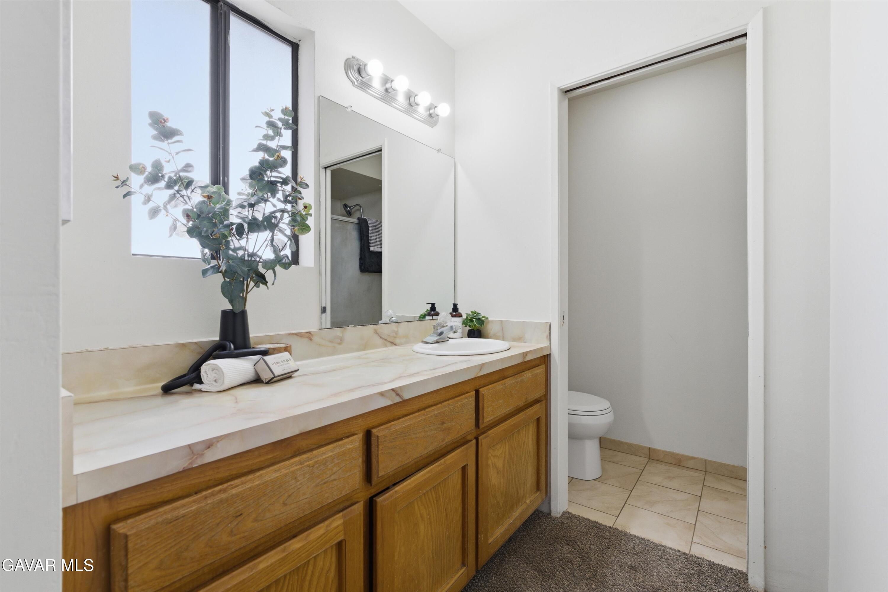 21410 Mission Street Tehachapi, CA 93561 - Photo 14 of 19 a bathroom with a sink and a mirror