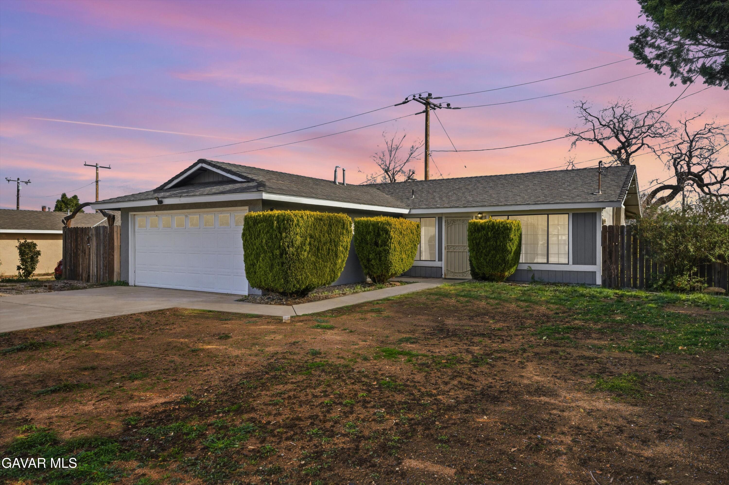 21410 Mission Street Tehachapi, CA 93561 - Photo 15 of 19 a front view of a house with a garden