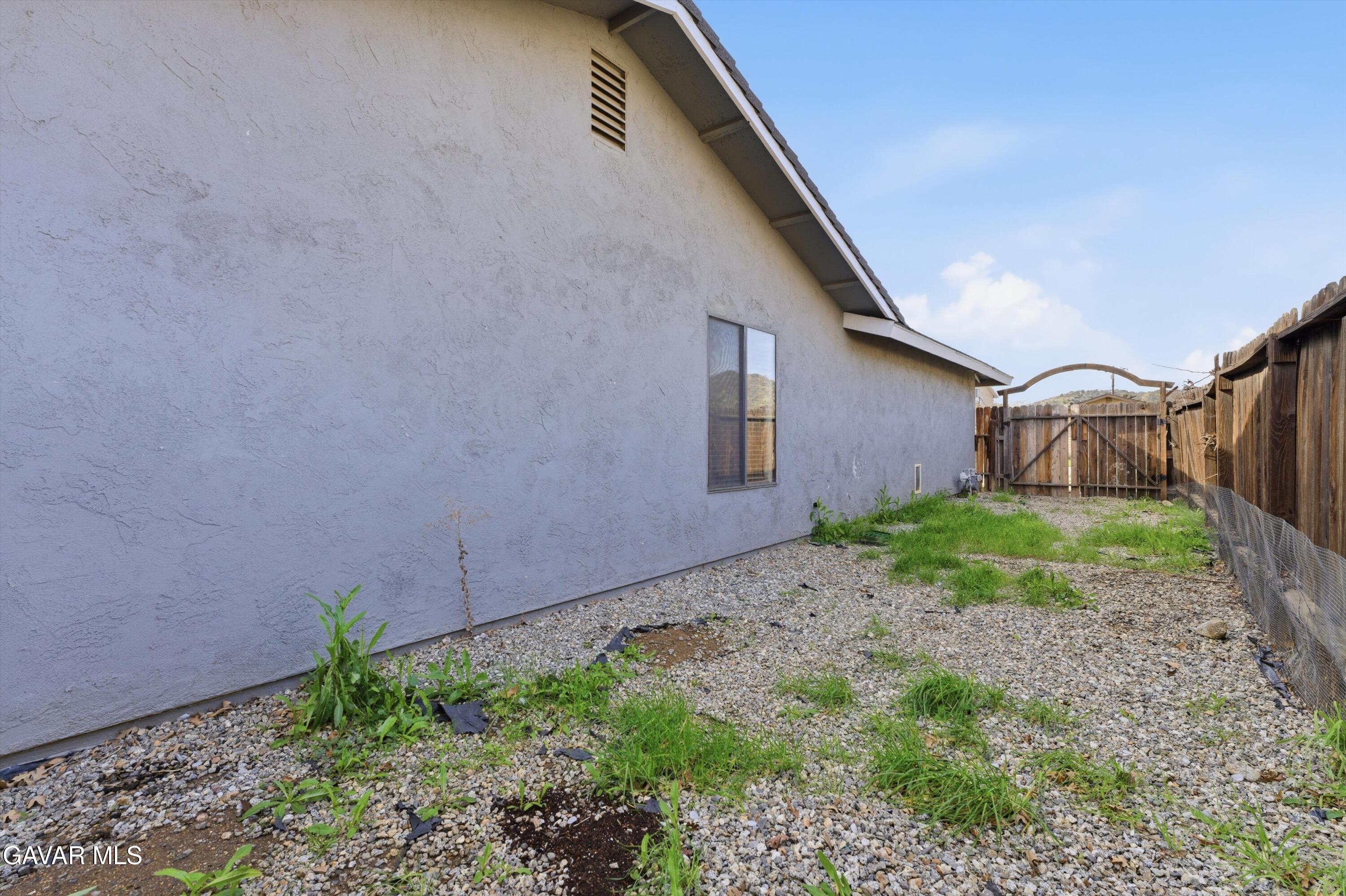 21410 Mission Street Tehachapi, CA 93561 - Photo 17 of 19 a house view with a backyard space