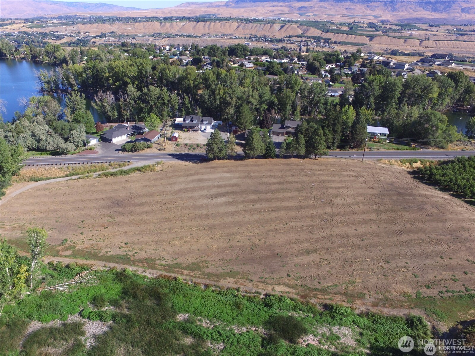 0 West Malaga Road Malaga, WA 98828 - Photo 10 of 36 an outdoor view of a house with a yard