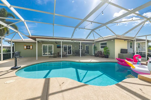 a view of a house with swimming pool