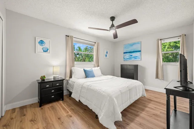 a bathroom with a sink toilet and mirror