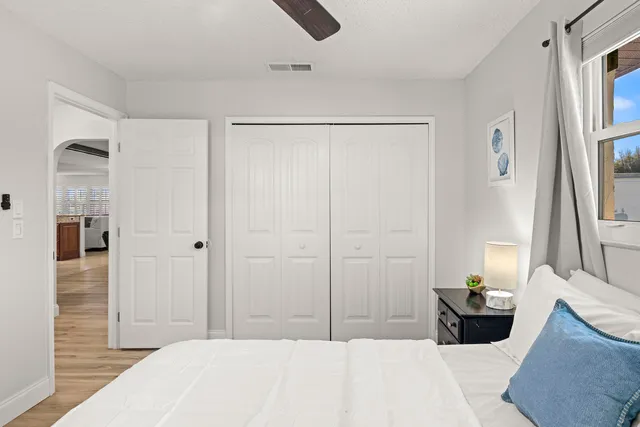 a spacious bathroom with a double vanity sink mirror and bathtub