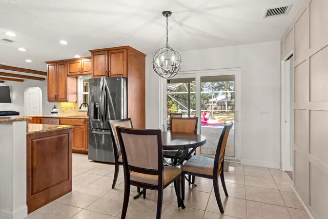 a kitchen with stainless steel appliances granite countertop a sink counter space and a stove