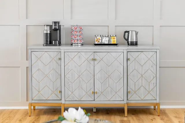 a spacious bathroom with a granite countertop tub sink shower and mirror