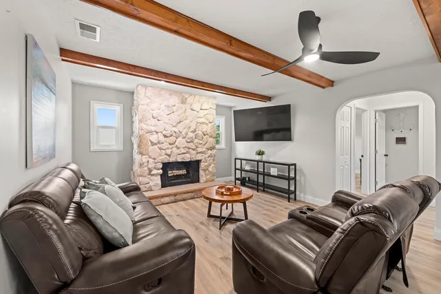 a living room with furniture and a table
