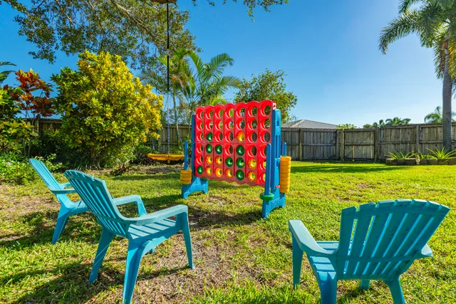 a view of an chairs and table in the garden