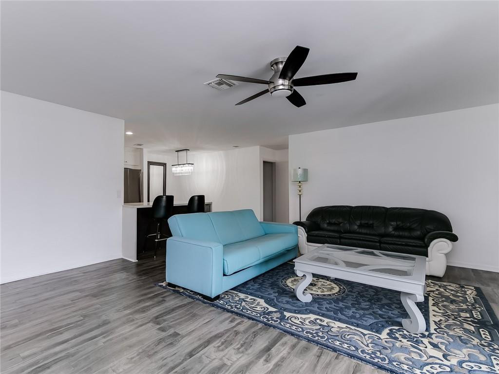 22735 Southwest 66th Avenue, Unit 202 Boca Raton, FL 33428 - Photo 12 of 30 a living room with furniture and a rug