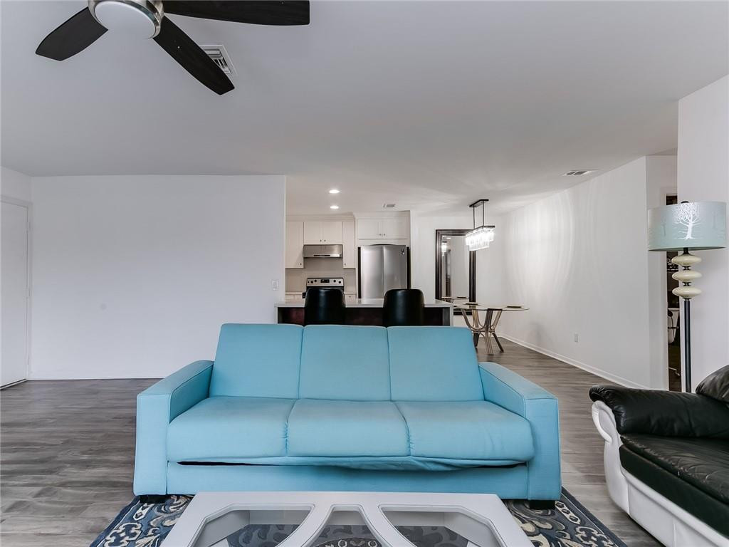 22735 Southwest 66th Avenue, Unit 202 Boca Raton, FL 33428 - Photo 13 of 30 a living room with furniture and a couch