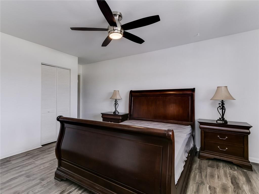 22735 Southwest 66th Avenue, Unit 202 Boca Raton, FL 33428 - Photo 14 of 30 a living room with furniture and a flat screen tv