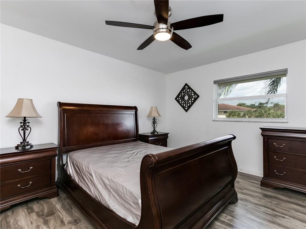 22735 Southwest 66th Avenue, Unit 202 Boca Raton, FL 33428 - Photo 15 of 30 a bedroom with a bed and a dresser