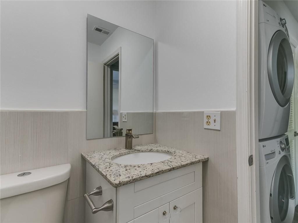 22735 Southwest 66th Avenue, Unit 202 Boca Raton, FL 33428 - Photo 19 of 30 a bathroom with a granite countertop sink and a mirror