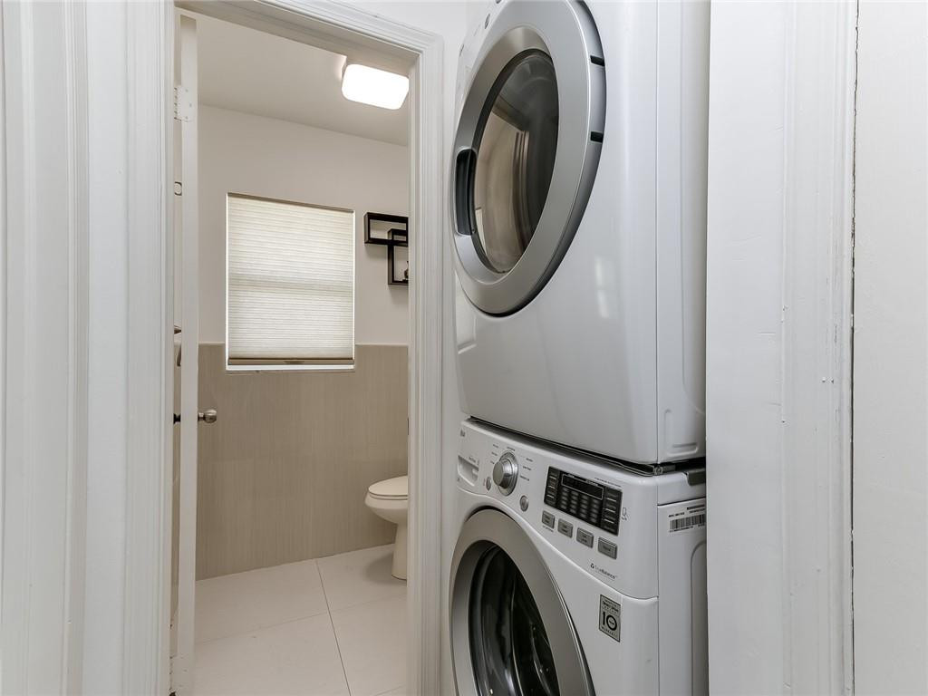 22735 Southwest 66th Avenue, Unit 202 Boca Raton, FL 33428 - Photo 21 of 30 a utility room with dryer and washer