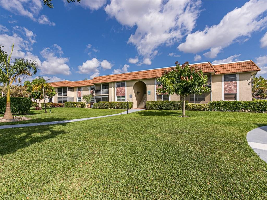 22735 Southwest 66th Avenue, Unit 202 Boca Raton, FL 33428 - Photo 28 of 30 a view of house with a big yard