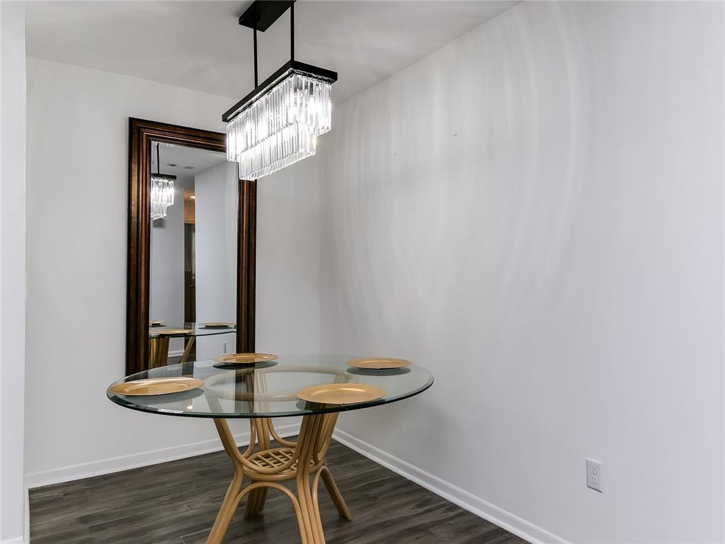 22735 Southwest 66th Avenue, Unit 202 Boca Raton, FL 33428 - Photo 7 of 30 a view of a room with a table and chairs