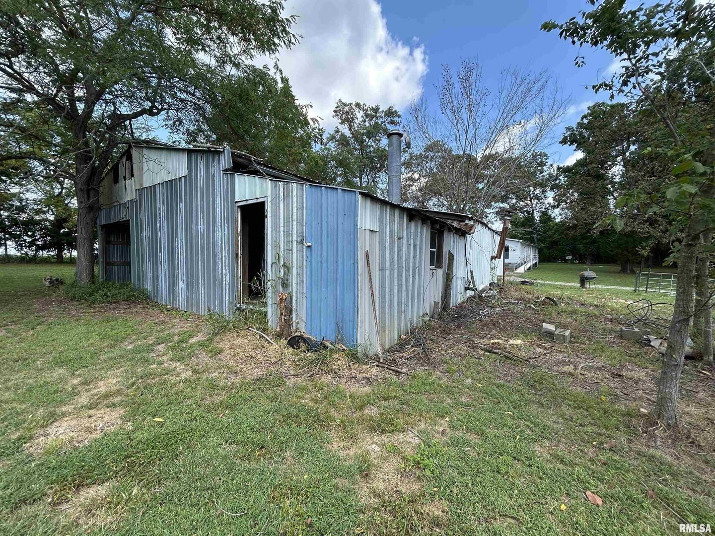 13536 Alleghany Road Thompsonville, IL 62890 - Photo 55 of 62 a view of a backyard with large trees and wooden fence