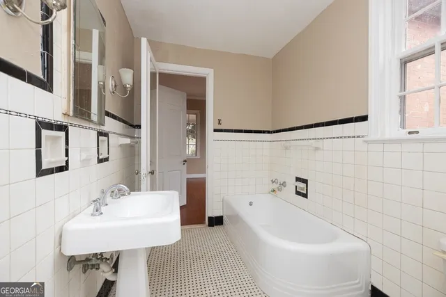 a bathroom with a sink and a bathtub