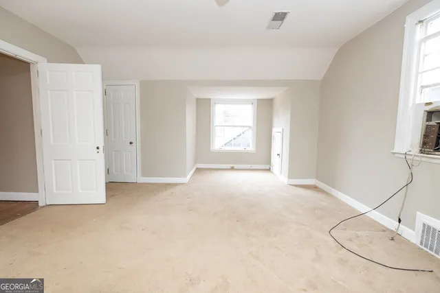 an empty room with windows