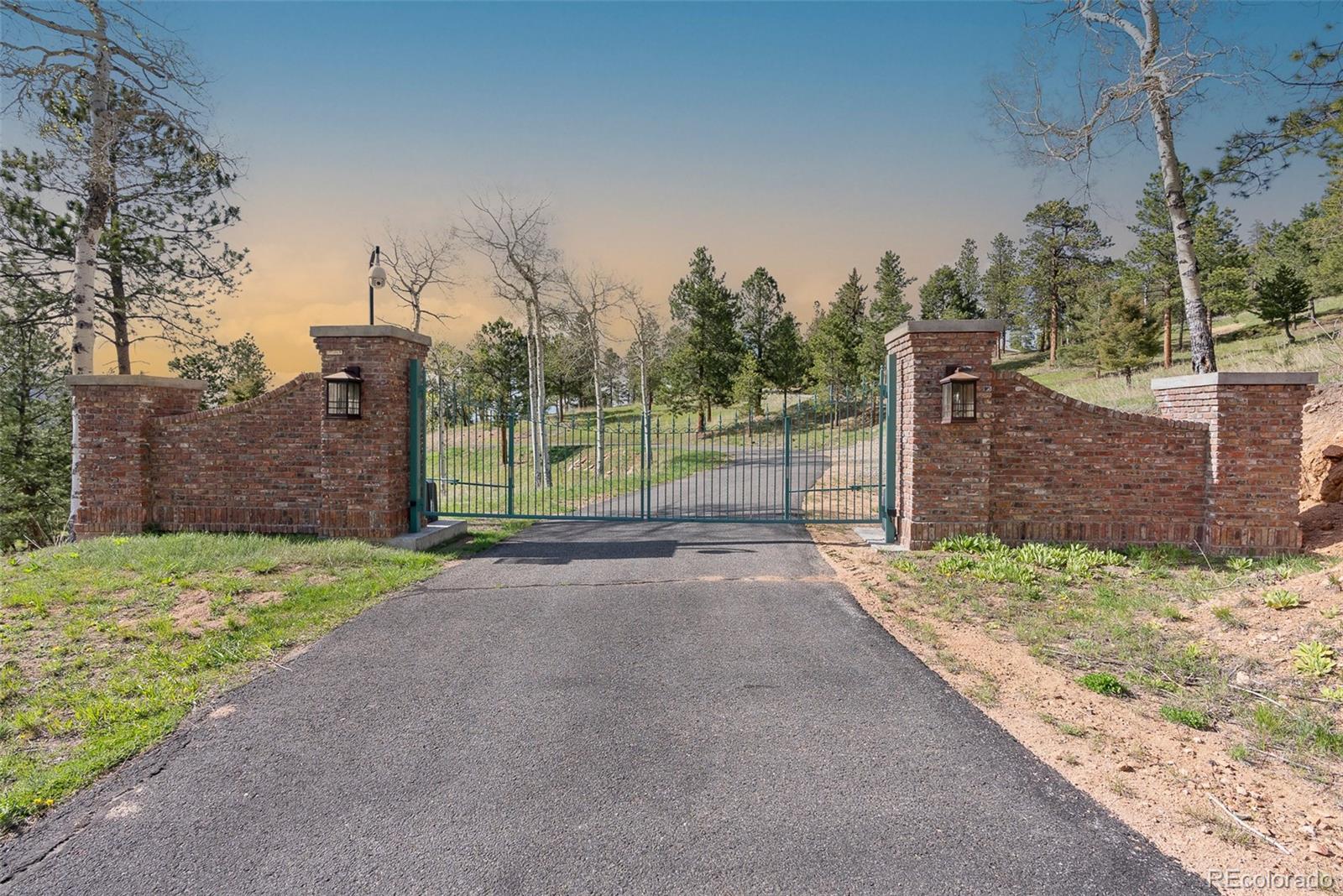 26271 Richmond Hill Road Conifer, CO 80433 - Photo 12 of 50 a view of a road with a trees in the background