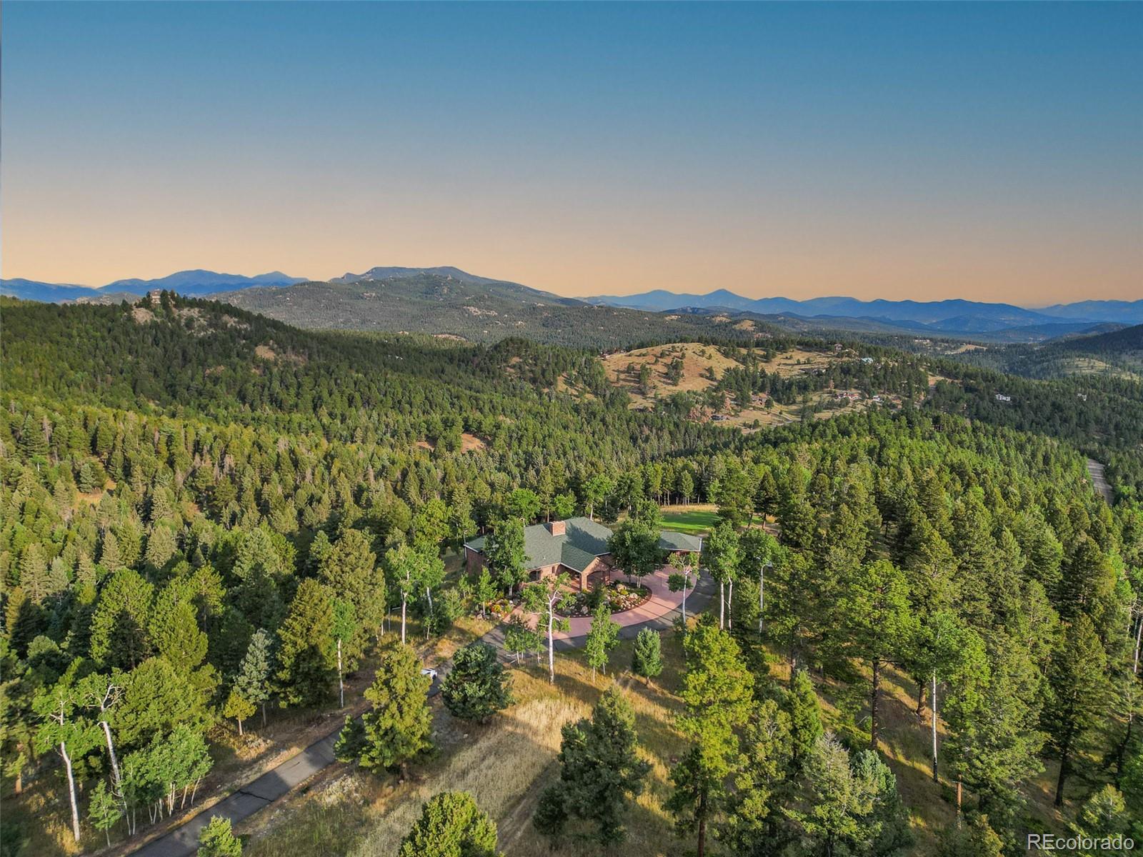 26271 Richmond Hill Road Conifer, CO 80433 - Photo 14 of 50 a view of a city with lush green forest