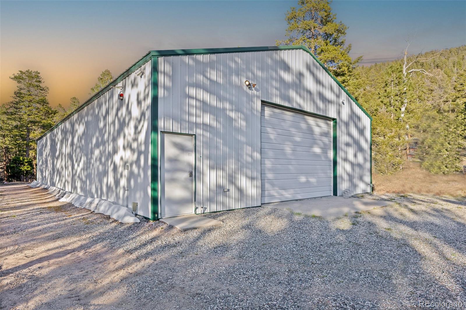 26271 Richmond Hill Road Conifer, CO 80433 - Photo 20 of 50 a view of a house with a yard