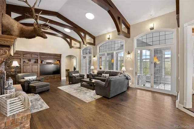 a living room with furniture ceiling fan and a rug