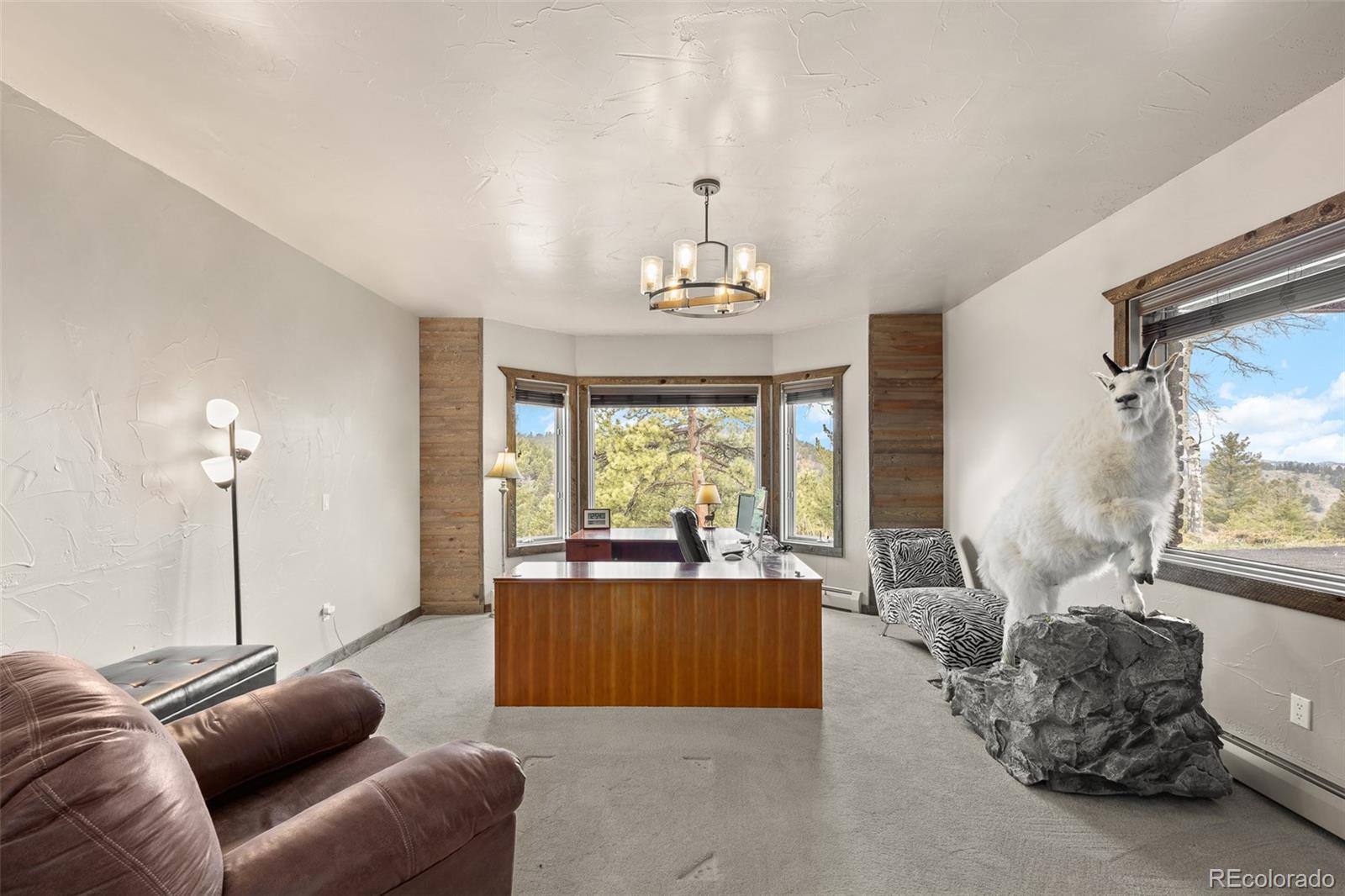 26271 Richmond Hill Road Conifer, CO 80433 - Photo 40 of 50 a living room with furniture and a large window