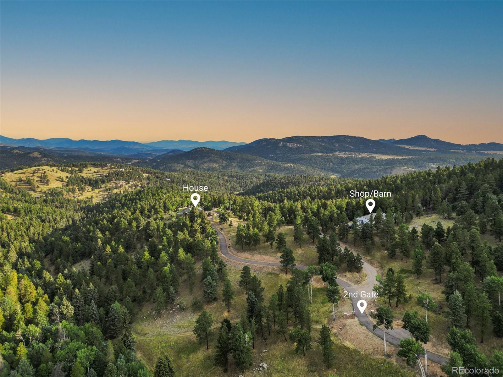 26271 Richmond Hill Road Conifer, CO 80433 - Photo 9 of 50 a view of a house with a street