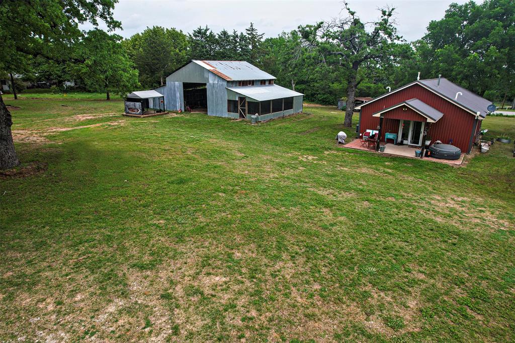 4850 Fm 1753 Denison, TX 75021 - Photo 14 of 23 a front view of a house with garden