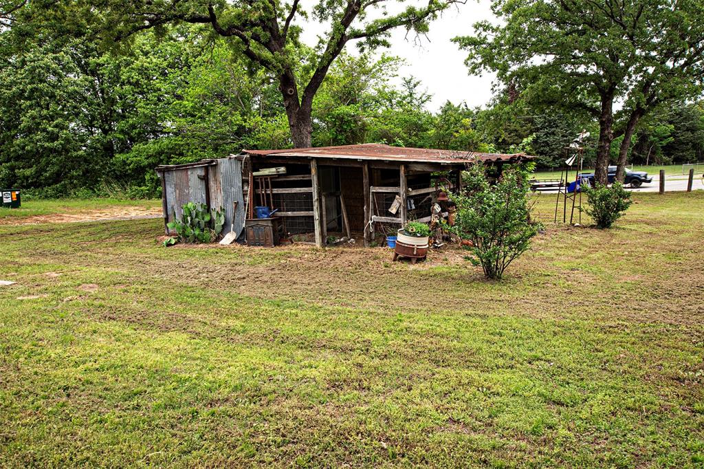 4850 Fm 1753 Denison, TX 75021 - Photo 23 of 23 a view of a house with backyard outdoor seating area and furniture