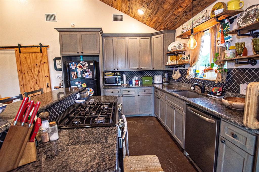 4850 Fm 1753 Denison, TX 75021 - Photo 4 of 23 a kitchen with lots of counter top space and stainless steel appliances