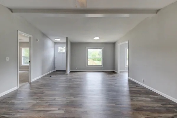 a view of an empty room with a window