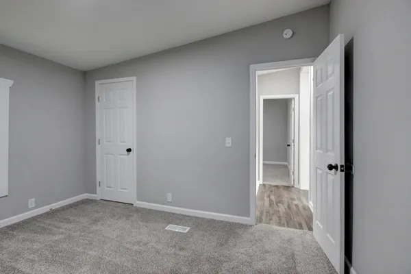 a view of a backyard of the house