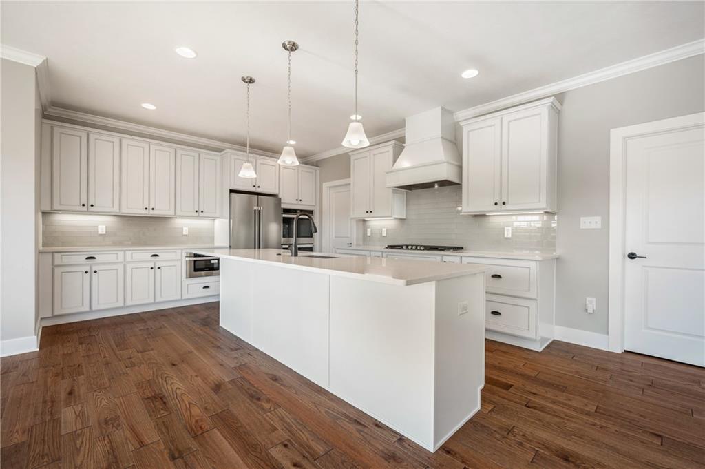 136 Pearce Road Mars, PA 16046 - Photo 12 of 44 a large kitchen with cabinets and wooden floor
