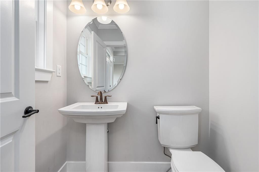 136 Pearce Road Mars, PA 16046 - Photo 14 of 44 a bathroom with a toilet a sink and a mirror