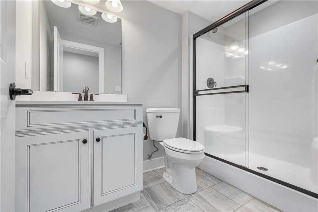 136 Pearce Road Mars, PA 16046 - Photo 30 of 44 a bathroom with a sink a toilet a mirror and shower