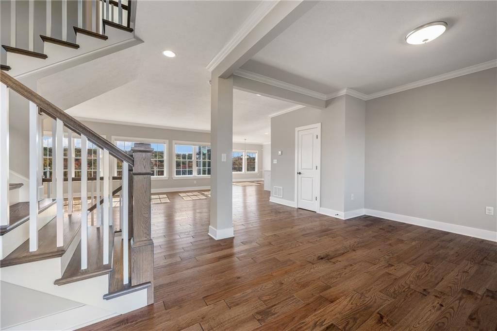 136 Pearce Road Mars, PA 16046 - Photo 4 of 44 wooden floor in an empty room with stairs
