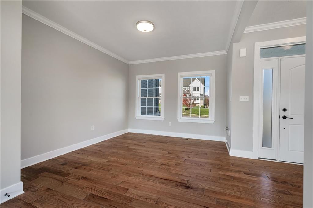 136 Pearce Road Mars, PA 16046 - Photo 5 of 44 a view of empty room with wooden floor and fan