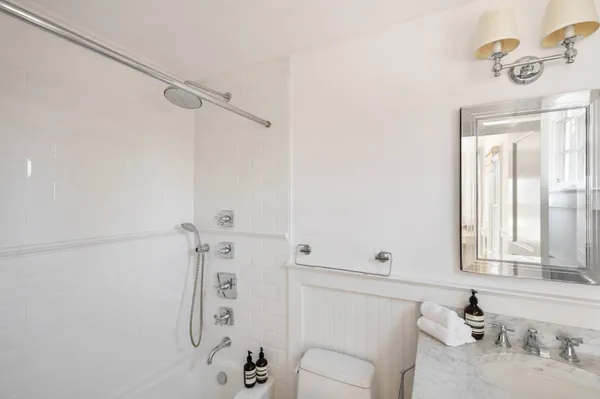 a bedroom with bed and window