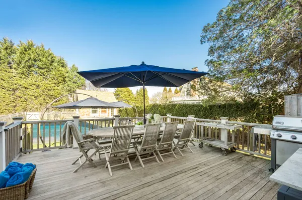 a view of a house with swimming pool and sitting area