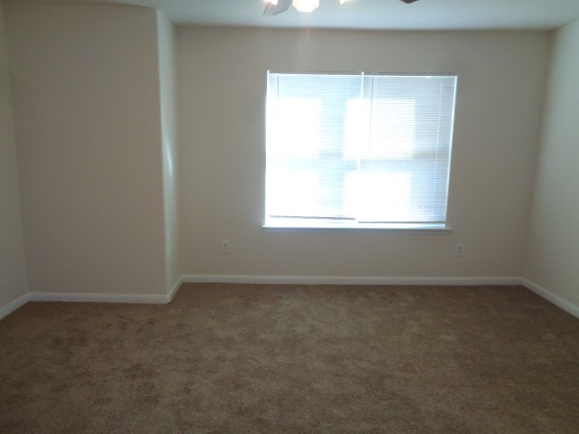 13018 Kingston Point Lane Houston, TX 77047 - Photo 11 of 28 an empty room with a window
