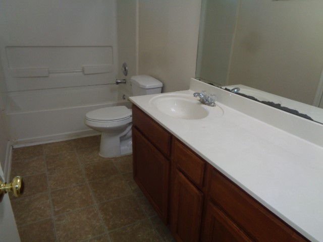 13018 Kingston Point Lane Houston, TX 77047 - Photo 22 of 28 a bathroom with a sink toilet and vanity