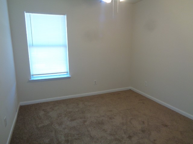 13018 Kingston Point Lane Houston, TX 77047 - Photo 25 of 28 an empty room with a window