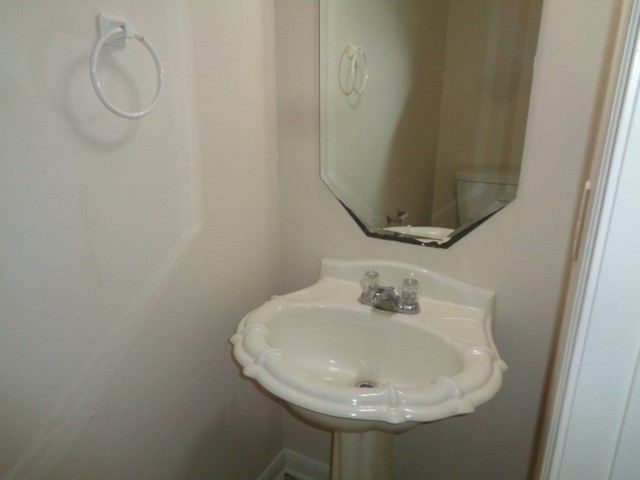 13018 Kingston Point Lane Houston, TX 77047 - Photo 7 of 28 a bathroom with a sink and mirror