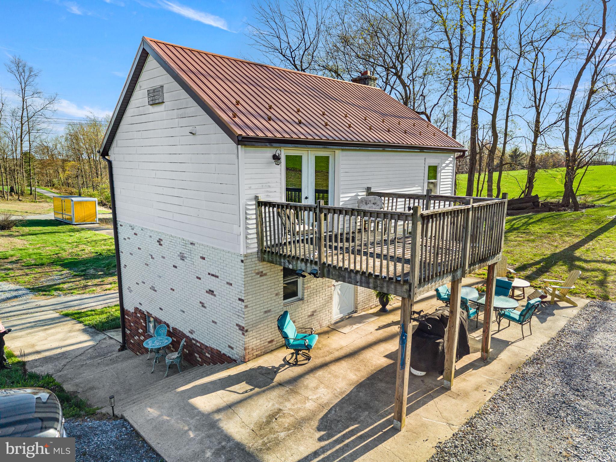 1725 Goosetown Road Coatesville, PA 19320 - Photo 12 of 34 a view of a house with a wooden deck
